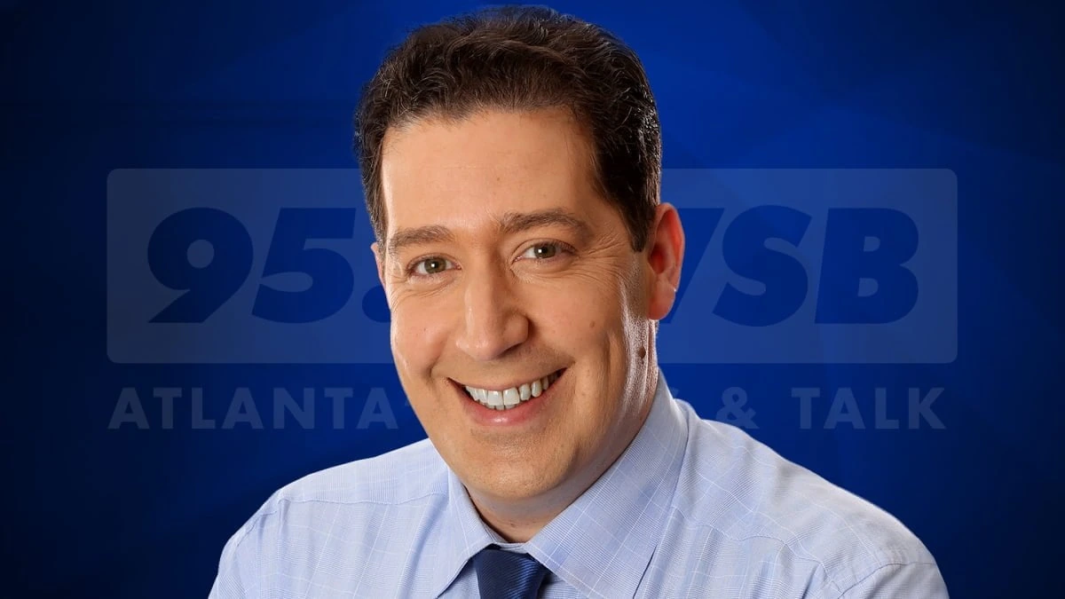 Mark Arum headshot in front of a 95.5 WSB Atlanta radio backdrop